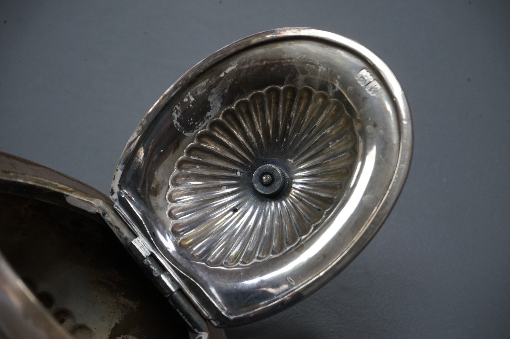 An Edwardian demi-fluted silver oval teapot, by Goldsmiths & Silversmiths Co Ltd, London, 1901, gross 18.8oz.